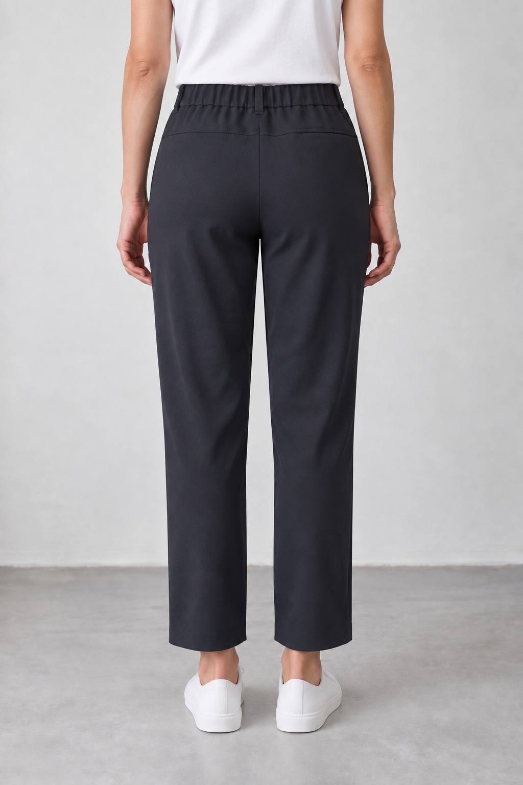 Back view of WITOLDI Arno navy pants showing a relaxed straight fit through the seat and leg