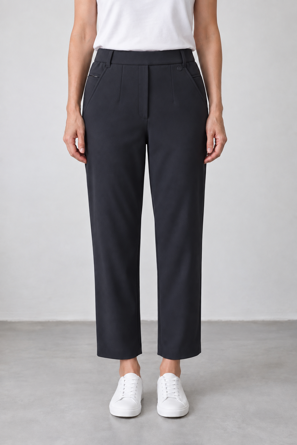 Woman wearing WITOLDI Arno navy straight-leg pants with an easy fit through the hip and thigh